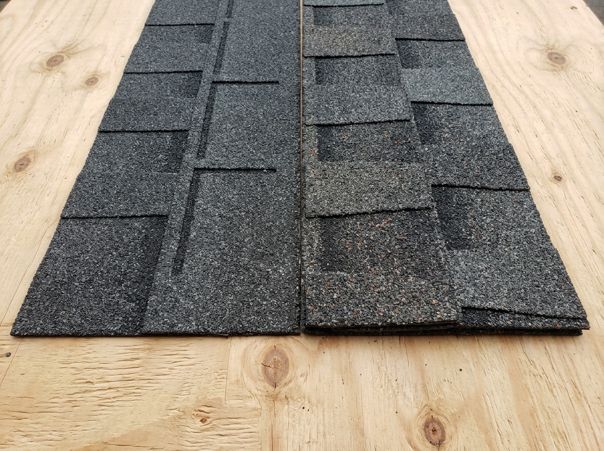 Close-up comparison of flat 3-tab shingles beside thicker laminated architectural shingles